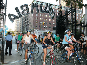 Cyclists enter College Walk through the Broadway gates during the Columbia Outdoor Orientation Program. Photo: Char Smullyan